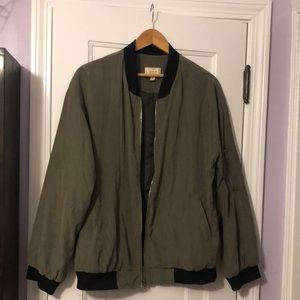 Women’s fashion jacket. Velvety green with black trim.